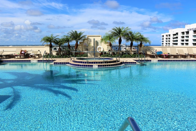 view of pool with a community hot tub