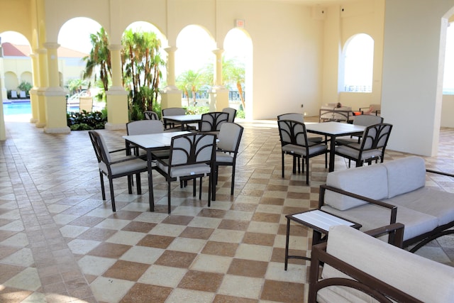 dining space featuring a high ceiling