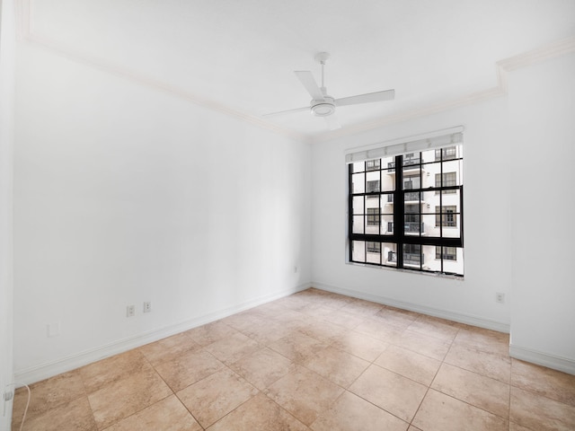 tiled spare room featuring ceiling fan and crown molding