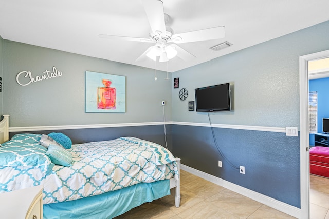 bedroom featuring tile patterned flooring and ceiling fan