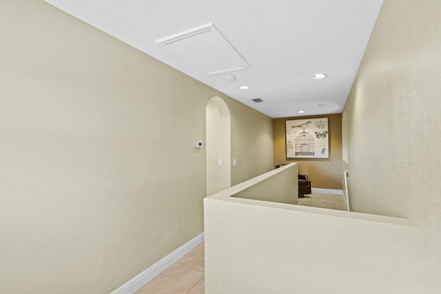 hallway with light tile patterned floors