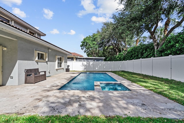 view of swimming pool with a patio area