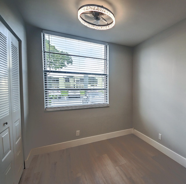 unfurnished room featuring hardwood / wood-style flooring and ceiling fan