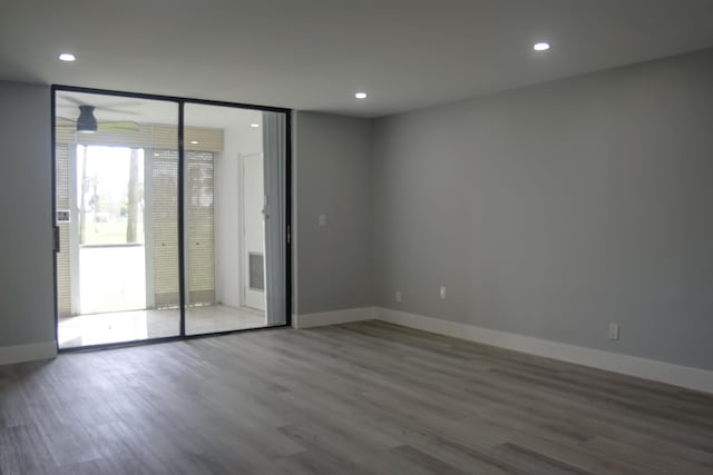 empty room featuring ceiling fan and wood-type flooring