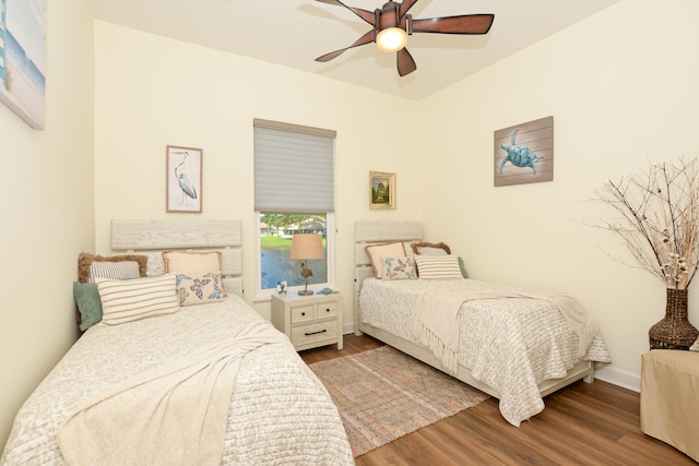 bedroom with hardwood / wood-style flooring and ceiling fan