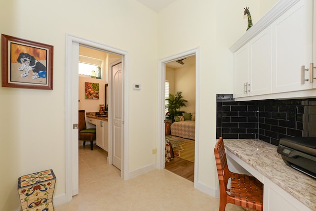 hallway featuring light tile patterned flooring