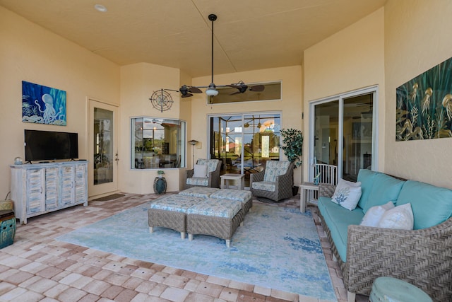 view of patio with outdoor lounge area and ceiling fan