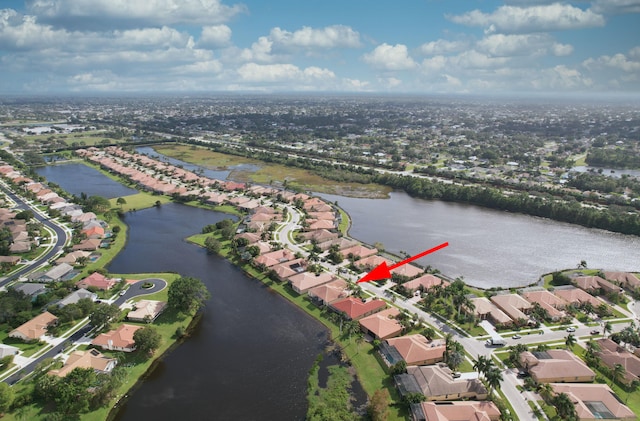 birds eye view of property with a water view