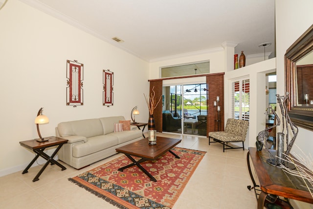 living room featuring light tile patterned floors and crown molding