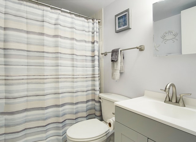 bathroom with vanity, toilet, and a shower with curtain