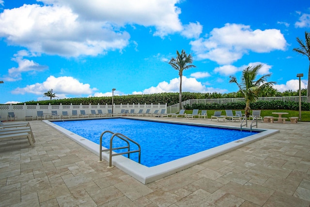 view of swimming pool featuring a patio area