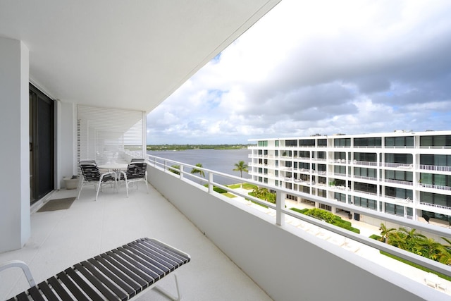 balcony featuring a water view