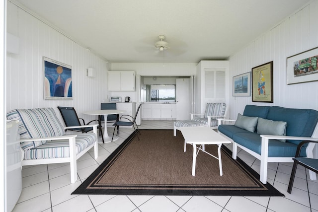 tiled living room featuring ceiling fan