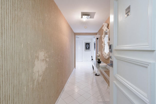 hall featuring light tile patterned flooring