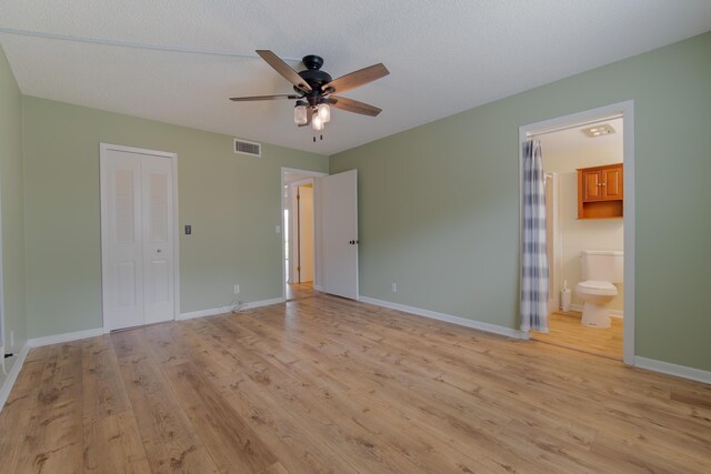 full bath featuring curtained shower, baseboards, vanity, and toilet