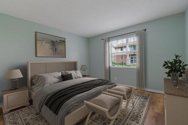 empty room with ceiling fan with notable chandelier, baseboards, and hardwood / wood-style flooring