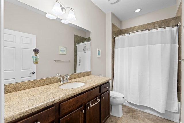 bathroom with toilet and vanity