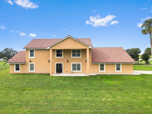 rear view of house with a lawn