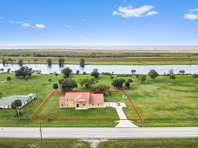 aerial view with a water view and a rural view