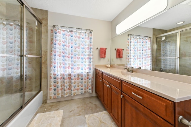 bathroom with vanity and bath / shower combo with glass door