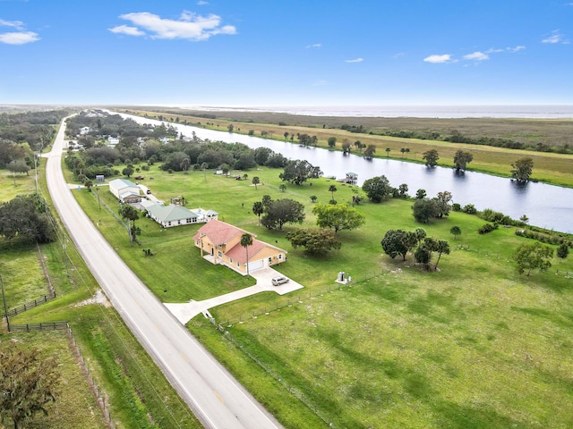 drone / aerial view with a water view and a rural view