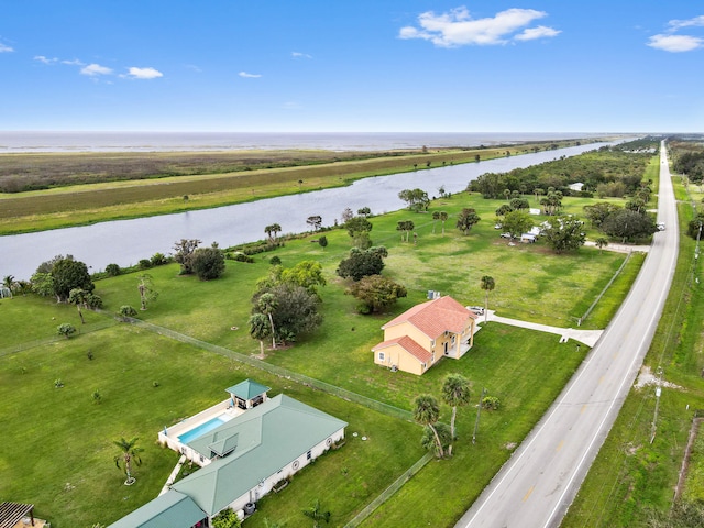 drone / aerial view featuring a water view and a rural view