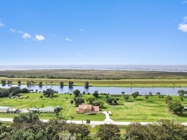 birds eye view of property with a rural view and a water view