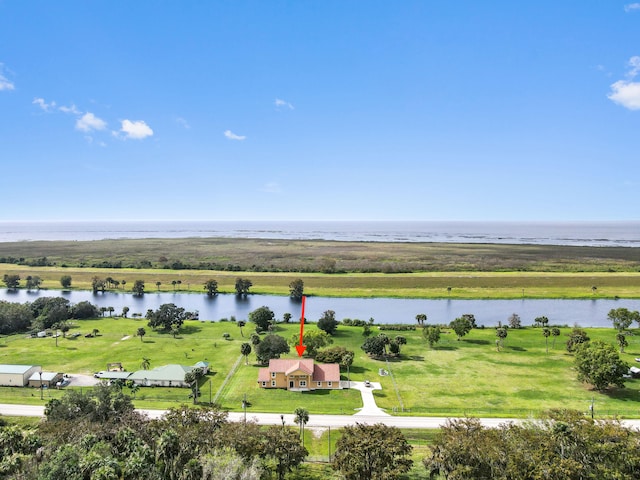 drone / aerial view featuring a rural view and a water view