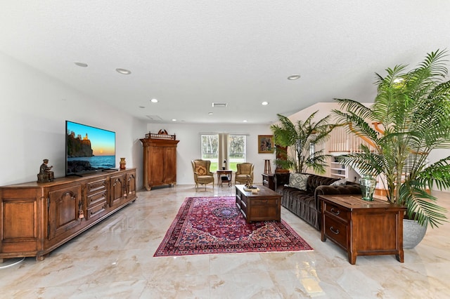 living room with a textured ceiling