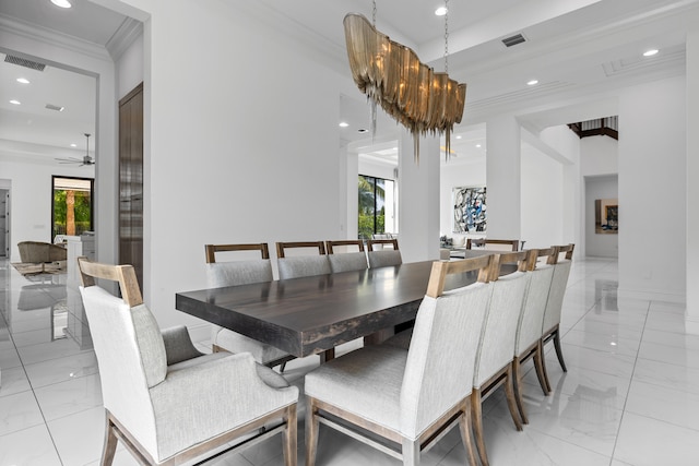 dining room featuring ceiling fan with notable chandelier and crown molding