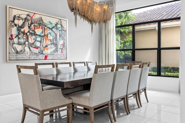 dining room with light tile patterned floors and a healthy amount of sunlight