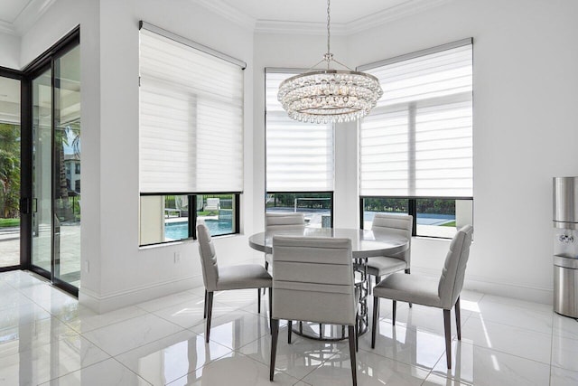 dining space featuring crown molding and a chandelier