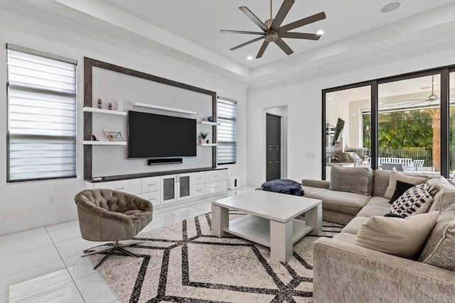 living room with crown molding and ceiling fan