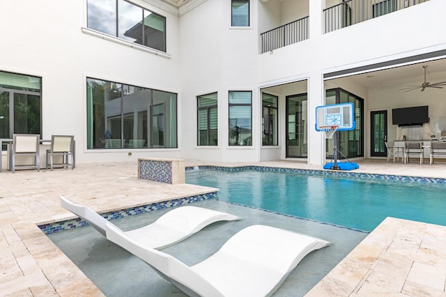 view of pool featuring a patio area and ceiling fan