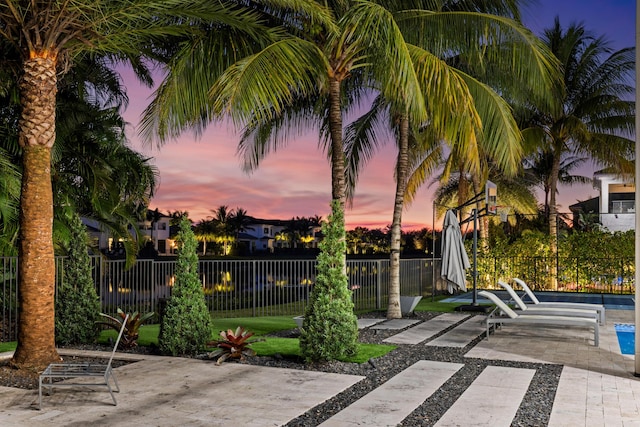 view of patio terrace at dusk