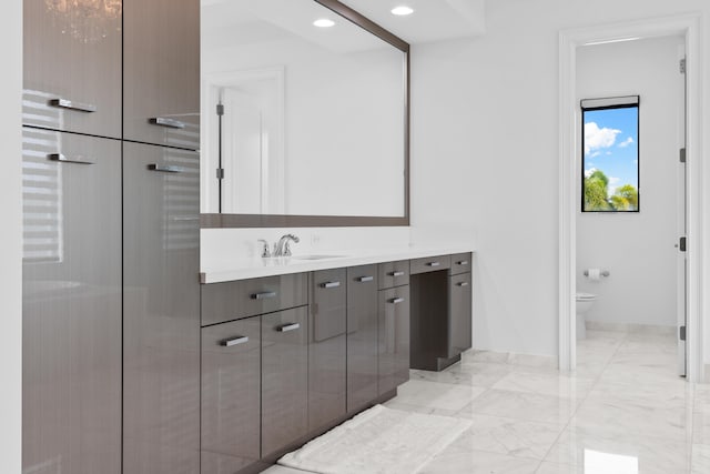 bathroom with vanity and toilet