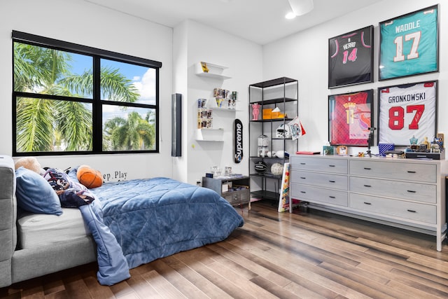 bedroom with hardwood / wood-style flooring