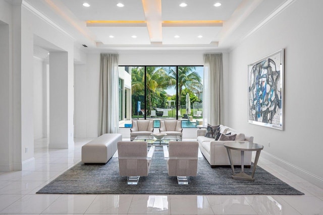 living room with a raised ceiling and ornamental molding