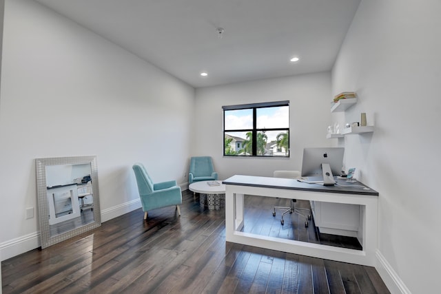 office space with dark wood-type flooring