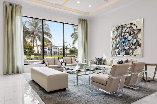 living room featuring plenty of natural light and ornamental molding