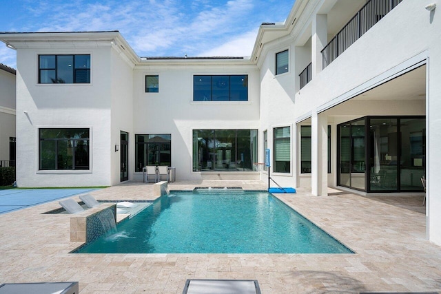 back of house with a patio area and pool water feature