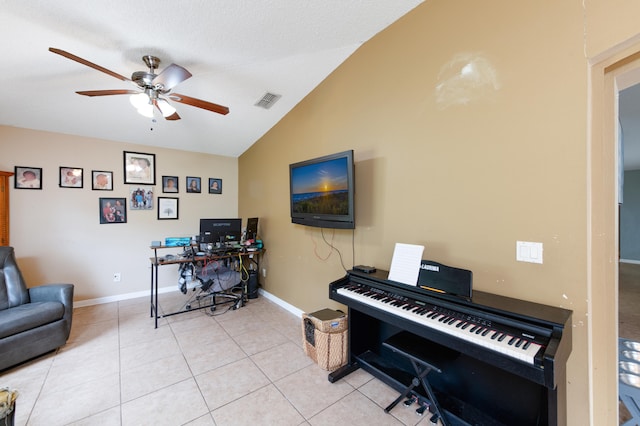 miscellaneous room with ceiling fan, lofted ceiling, and light tile patterned floors