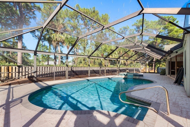 view of pool featuring an in ground hot tub, a lanai, and a patio area