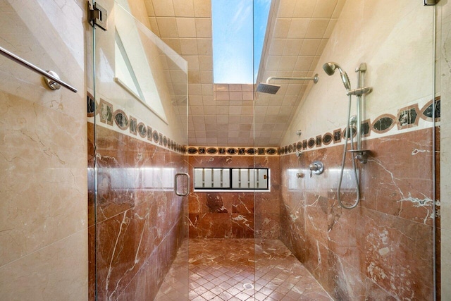 bathroom with a shower with shower door