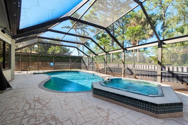 view of pool featuring glass enclosure and a patio