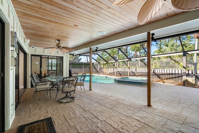 view of patio featuring a pool with hot tub, ceiling fan, and a lanai