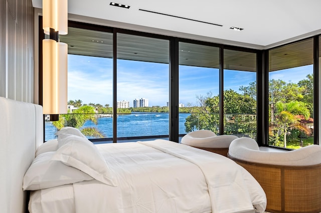 bedroom featuring a water view