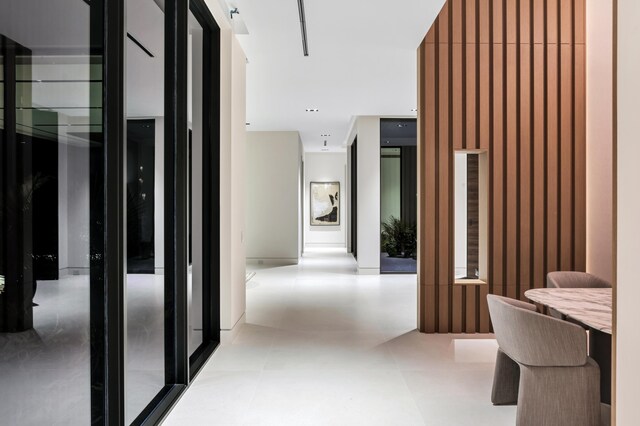 corridor with light tile patterned floors