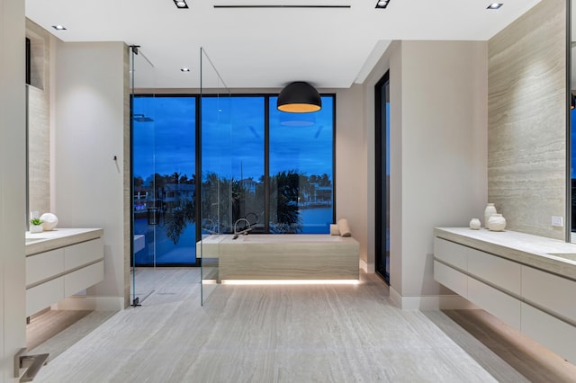 bathroom with wood-type flooring, vanity, and independent shower and bath