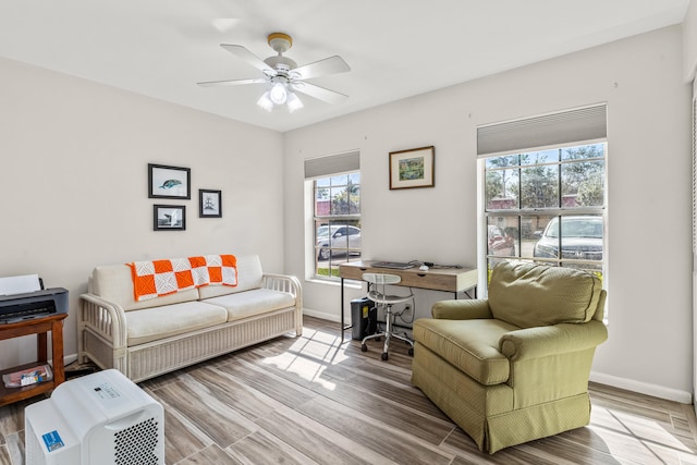 office space featuring light hardwood / wood-style flooring and ceiling fan